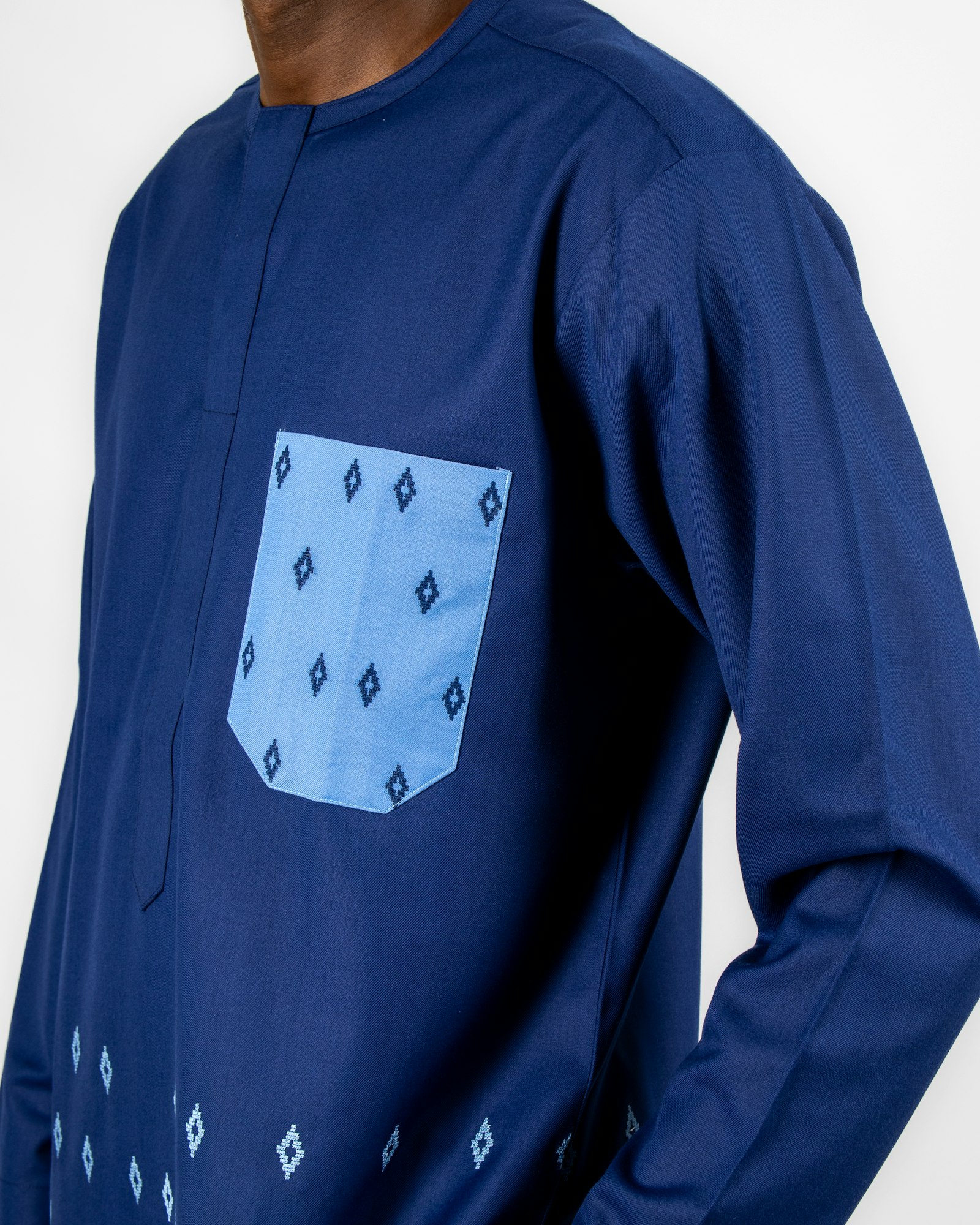 Navy kaftan with a pale blue embroidered pocket