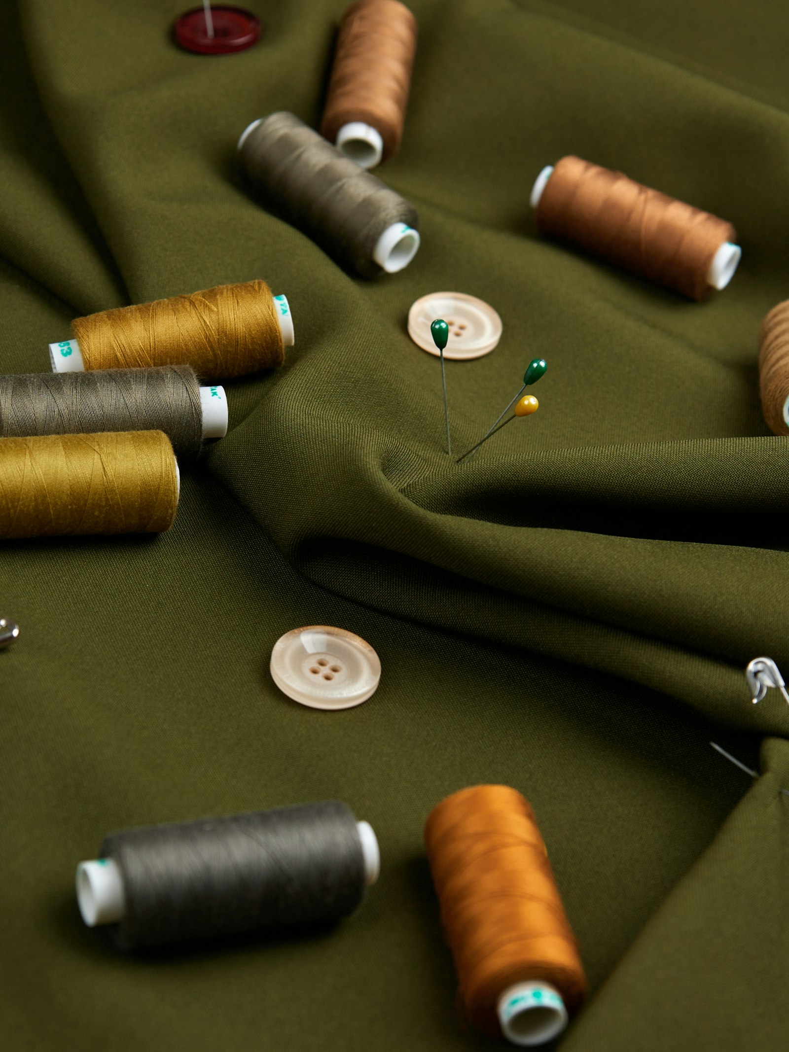 Olive wool with thread spools and horn buttons