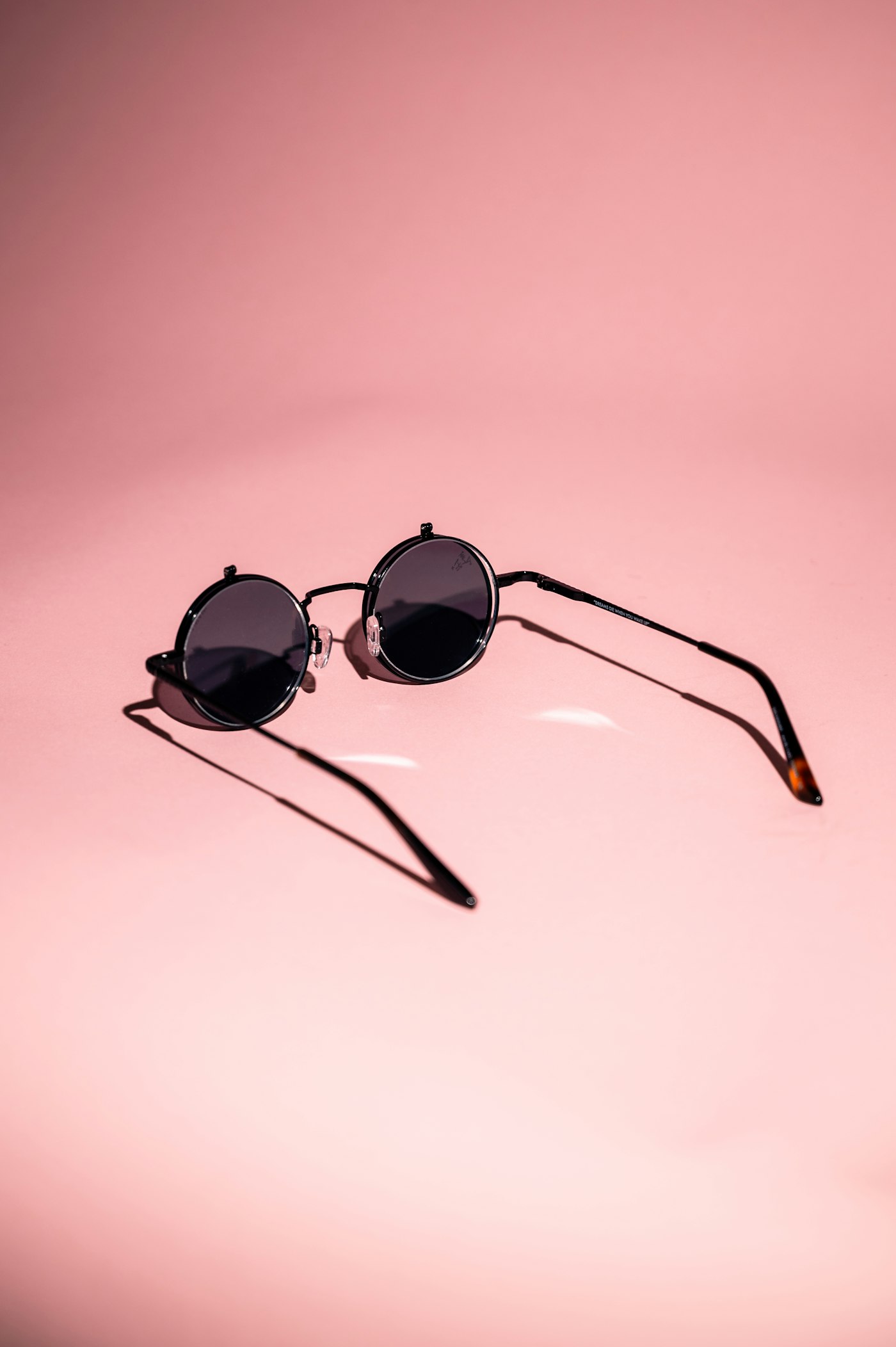 Round sunglasses with black frames