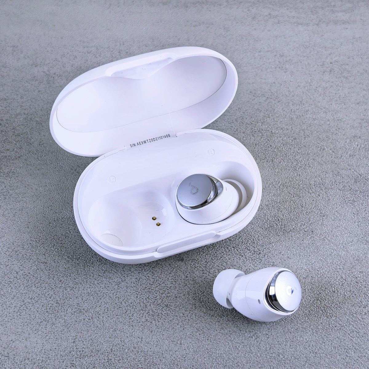 True wireless earbuds with charging case