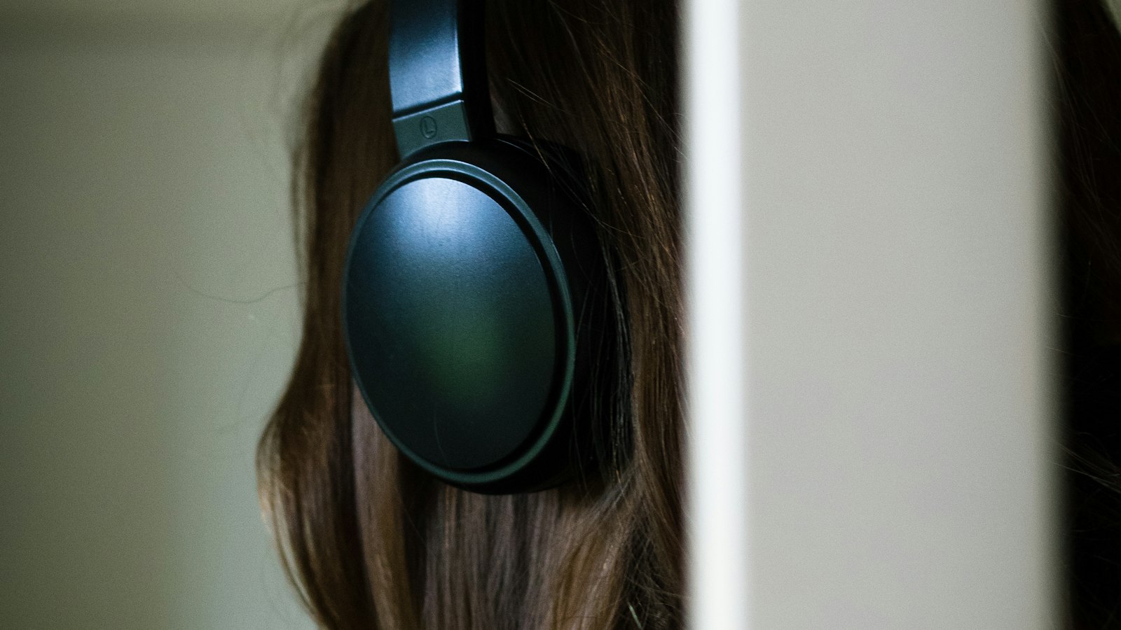 Wireless earbuds beside a phone